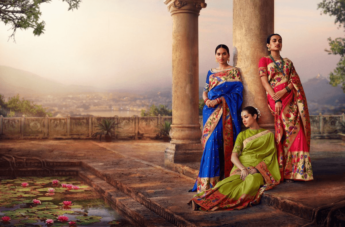 Yanai motif sarees in courtyard setting